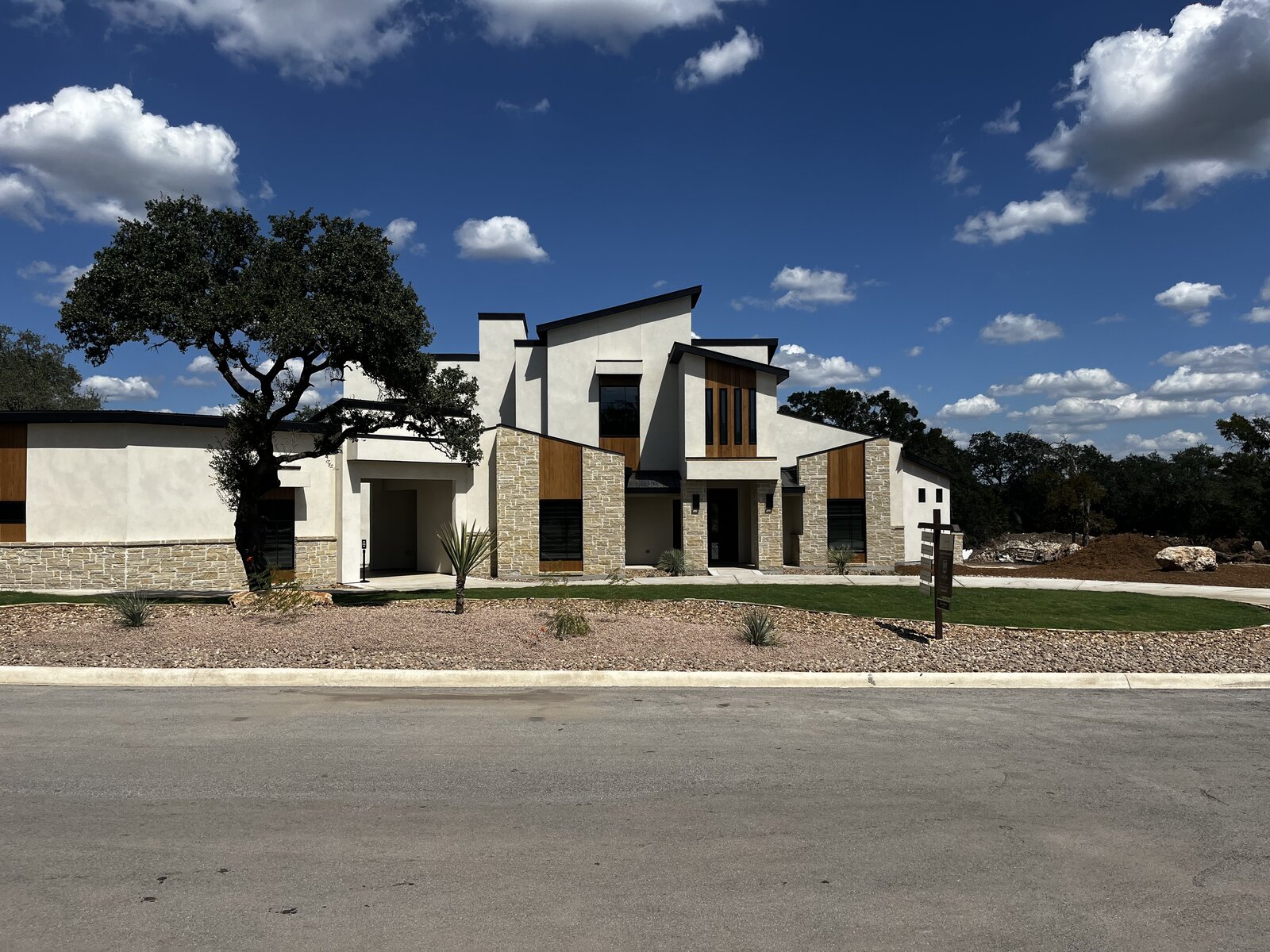 Xeriscape gravel bed and green turf
